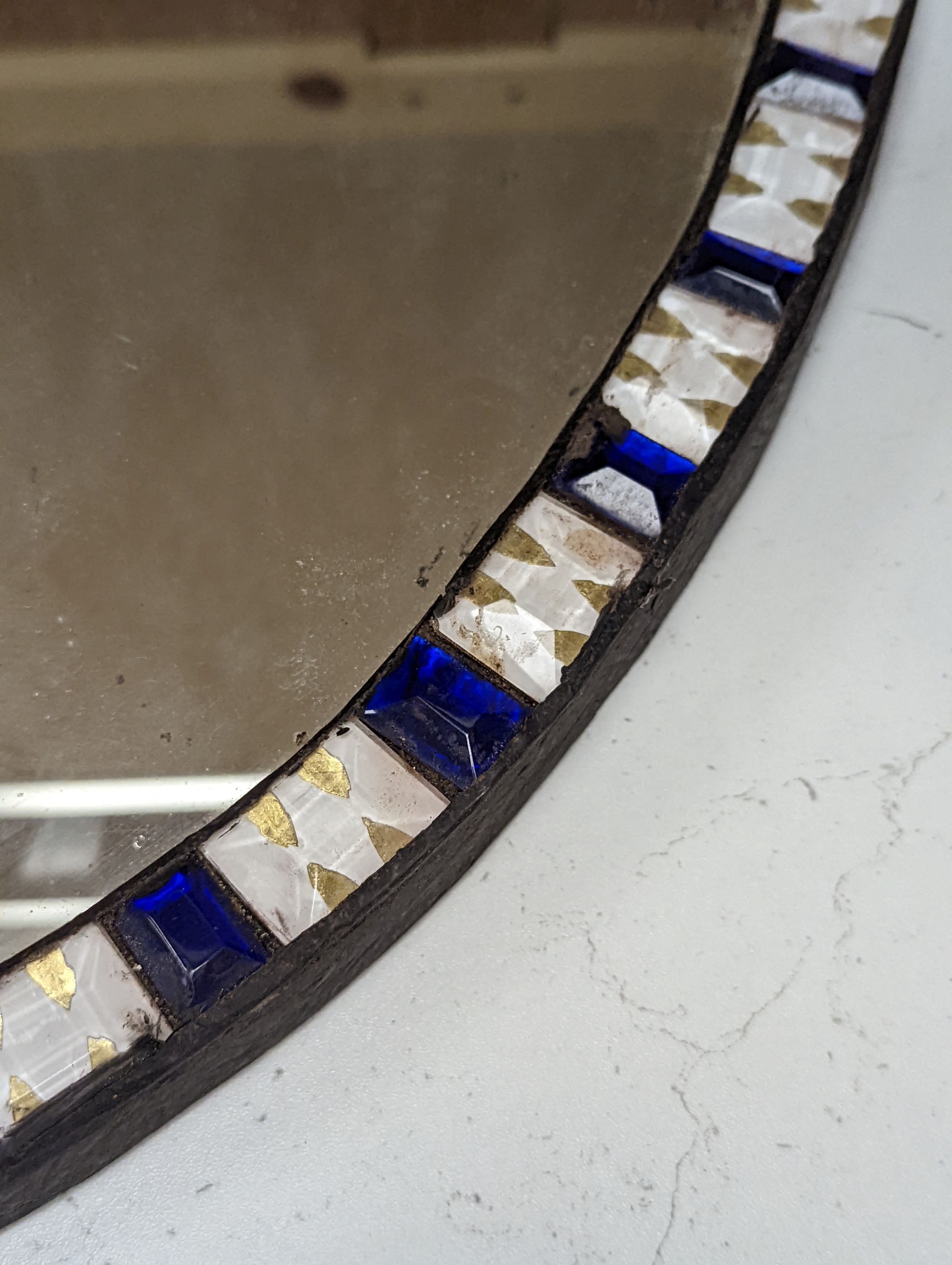An oval Irish-style wall mirror, 56x41cm